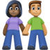 👩🏿‍🤝‍👨🏽 woman and man holding hands: dark skin tone, medium skin tone display on Facebook